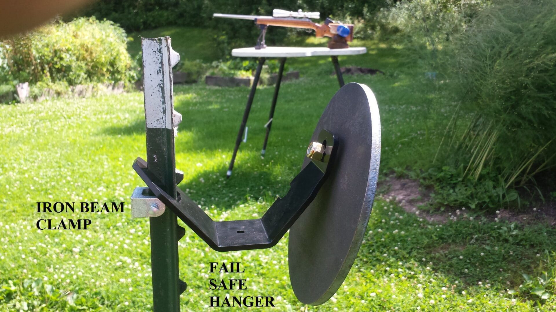 Hang Fast 10 inch round AR 500 steel target and Fail Safe Hanger mounted on a T-Post