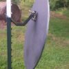 Hang Fast STANDARD T Post hanger with 24 inch round AR500 steel plate hanging on a short chain section