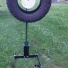 Hang Fast Tire Target System with 12 inch AR500 steel plate inside a truck tire mounted on an All Terrain T Post stand