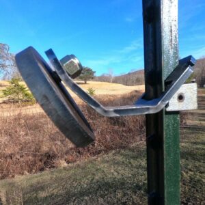 Hang Fast Mini hanger with a 4 inch round AR 500 target plate mounted on a T post