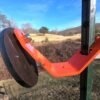Hang Fast Fail Safe T Post target hanger with 6 inch round AR500 target plate mounted on a T Post.