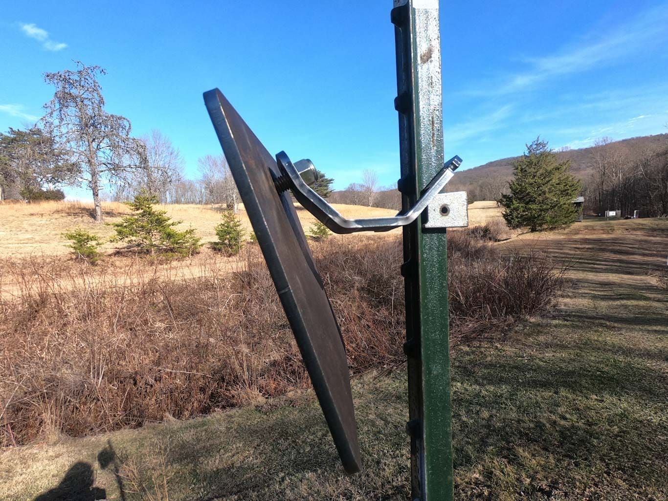 Hang Fast Mini hanger with a 8 x 10 inch AR 500 target plate mounted on a T post