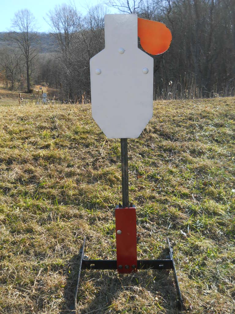 Hang Fast IPSC Hostage Swinger Target mounted on our armored All-Terrain T Post base