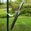 Solar panel mounted on a metal pole in a grassy outdoor area